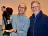 Hugo zeigt Bruno die Kristall verzierte Magnumflasche
